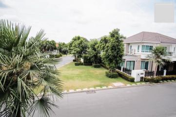 Suburban house exterior with front yard and garden