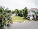 Suburban house exterior with front yard and garden