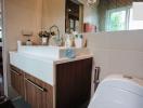 Modern bathroom interior with vanity cabinet and toilet