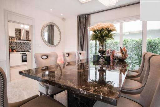 Elegant dining room with a modern marble table and comfortable chairs