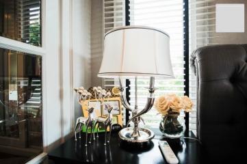 Cozy living room detail with stylish lamp and decorative items