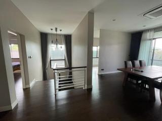 Spacious living room with dining area and hardwood floors