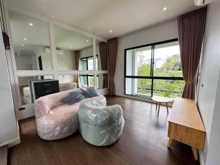 Spacious and well-lit living room with large windows