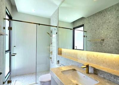 Modern bathroom interior with spacious glass shower, sleek design, and elegant fixtures