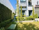 Elegant residential building seen from a well-maintained garden