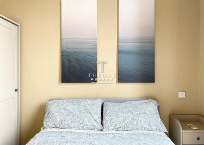 Cozy bedroom with a double bed and decorative wall art