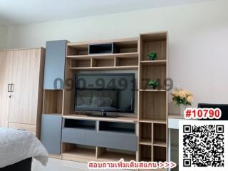 Modern bedroom interior with entertainment unit and flat screen TV
