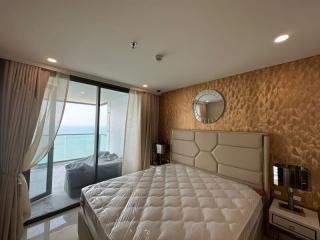 Cozy bedroom with ocean view and elegant interior design