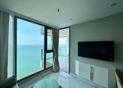 Modern living room with ocean view and balcony access