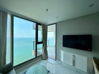 Modern living room with ocean view and balcony access