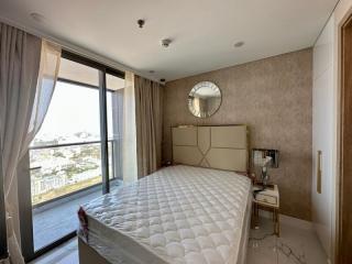 Modern bedroom with large window and city view