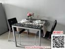 Modern dining table set with chairs and elegant tableware