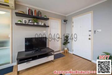 Modern living room with television and shelving unit