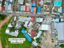 Aerial view of a residential and commercial area with buildings and streets