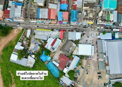 Aerial view of a residential and commercial area with buildings and streets