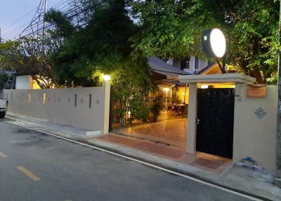 Evening view of a cozy home exterior with illuminated entrance
