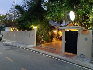 Evening view of a cozy home exterior with illuminated entrance