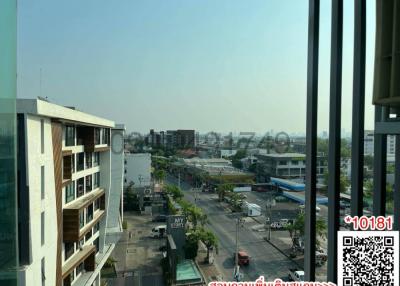 Cityscape view from a high-rise apartment balcony