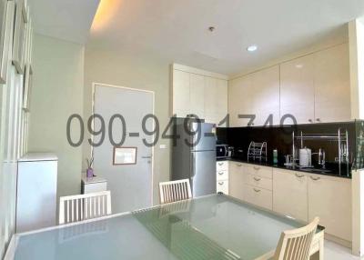 Modern kitchen with dining area and fitted appliances