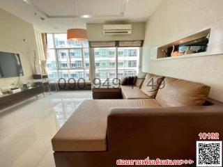 Contemporary styled living room with ample seating and natural light