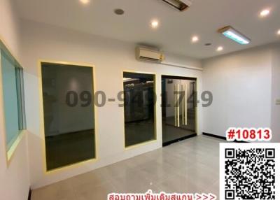 Spacious and well-lit interior space with large mirrors and air conditioning unit