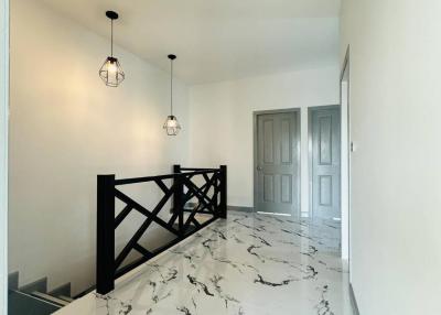 Bright and modern hallway with marble flooring