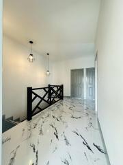 Bright and modern hallway with marble flooring