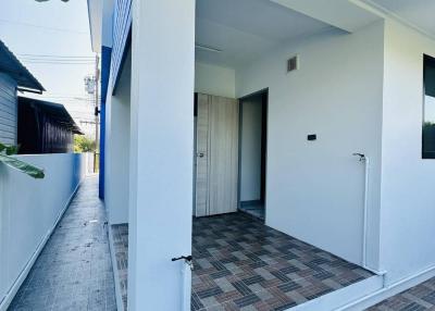 Modern home entrance with tile flooring
