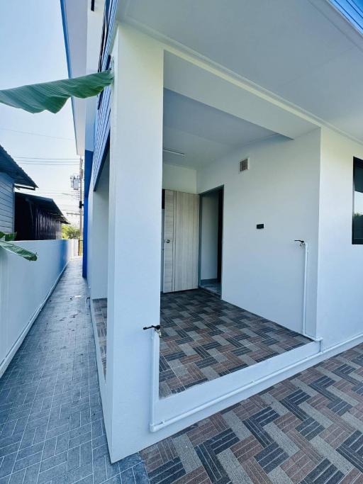 Modern home entrance with tile flooring