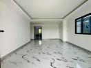 Spacious and modern living space with high gloss marble flooring