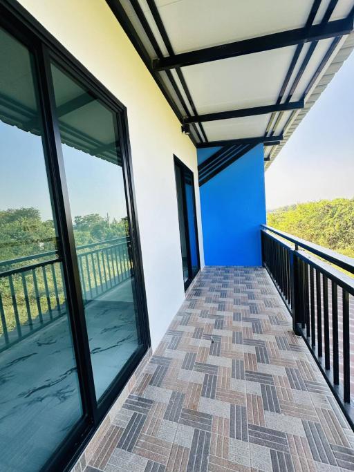 Spacious balcony with glass barrier and scenic view