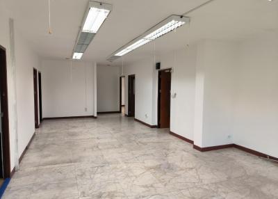 Spacious empty interior of a building with marble flooring