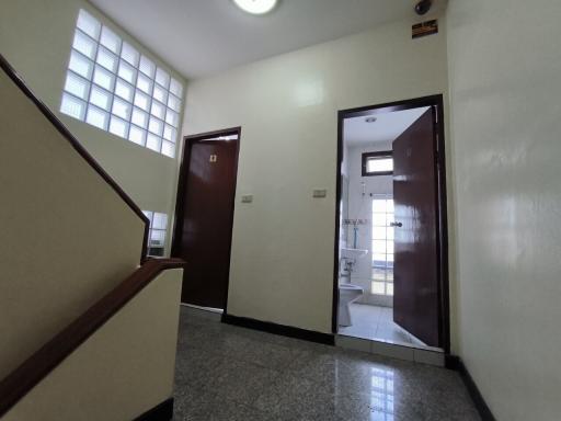 Entrance area with staircase and doors to rooms