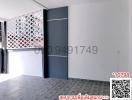 Modern building entrance with decorative partition wall and tiled flooring