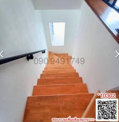 Wooden staircase with natural lighting