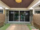 Spacious patio area with modern sliding doors and decorative ceiling