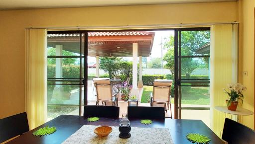 Bright and spacious dining area with view to the patio