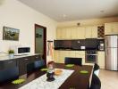 Modern kitchen with dining area, stainless steel appliances, and ample cabinetry