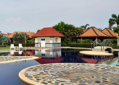 Residential complex with a large outdoor pool and lounging area