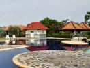 Residential complex with a large outdoor pool and lounging area