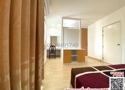 Spacious Bedroom with Large Bed and Office Area