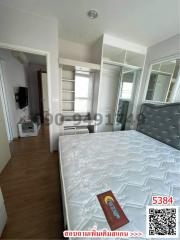 Spacious bedroom with large bed and modern amenities