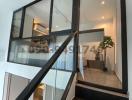 Modern staircase in a home interior with glass balustrade