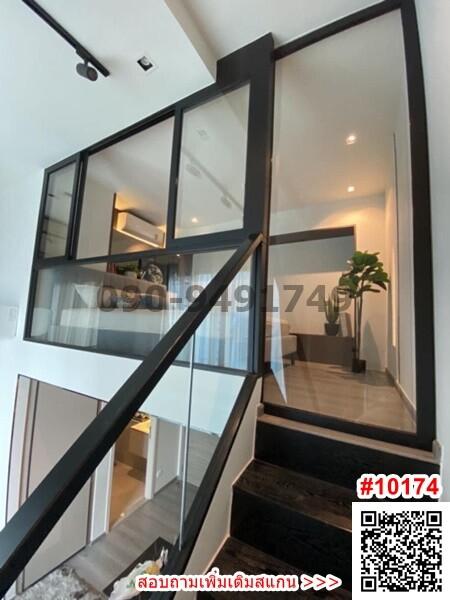 Modern staircase in a home interior with glass balustrade