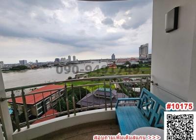Spacious balcony with river view and outdoor seating