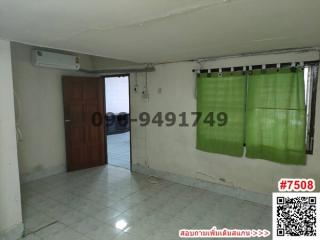Spacious room with ceramic tiles, air conditioning unit, and green curtains
