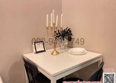 Elegant dining area with a table set and decorative candles