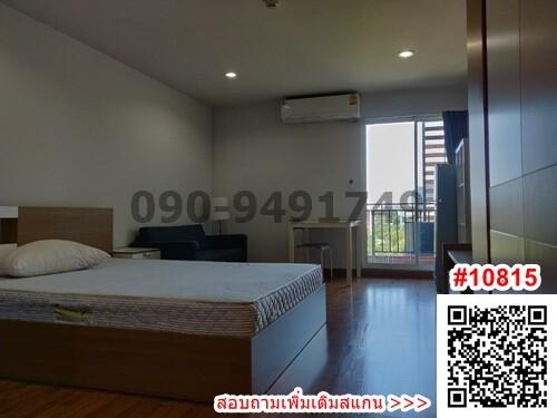 Spacious bedroom with modern design and balcony access