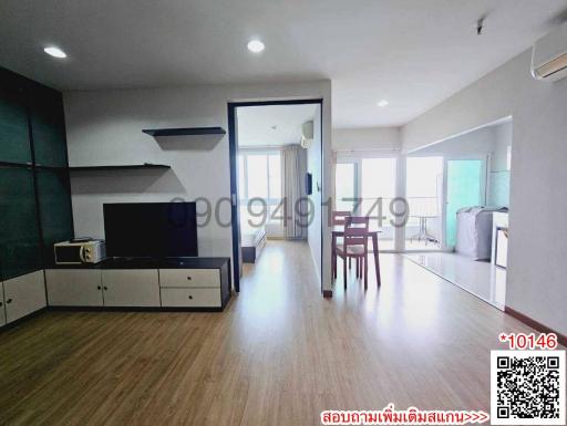 Spacious and well-lit living room with open floor concept leading to a balcony