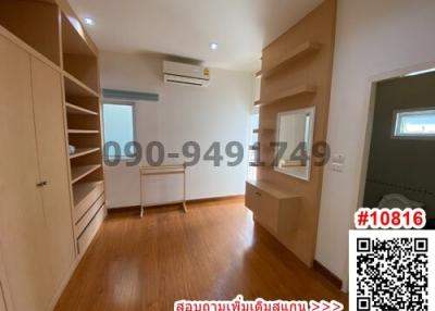 Spacious bedroom with built-in wardrobes and air conditioning